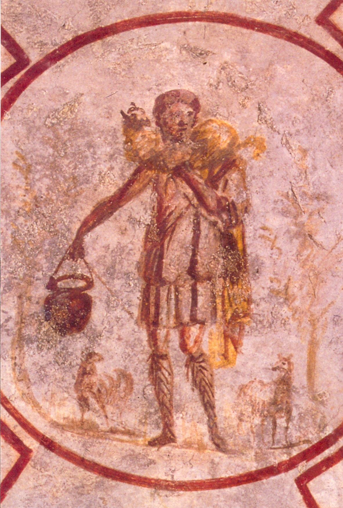 A faded catacomb ceiling fresco of the Good Shepherd carrying a sheep on his shoulders, a milk pail in one hand and two sheep at his feet.