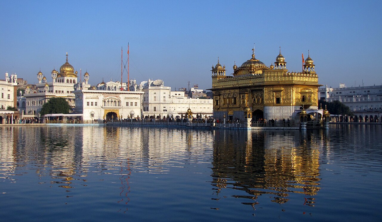 The Golden Temple and the Akal Takht across the sarovar at Amritsar, reflected in the sacred pool.