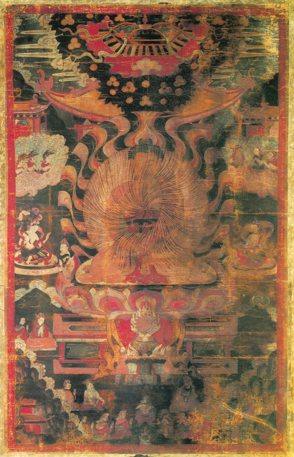 An 18th-century Tibetan thangka of Shakyamuni Buddha enthroned beneath a canopy, his body radiating rainbow light, deities and devotees around him.