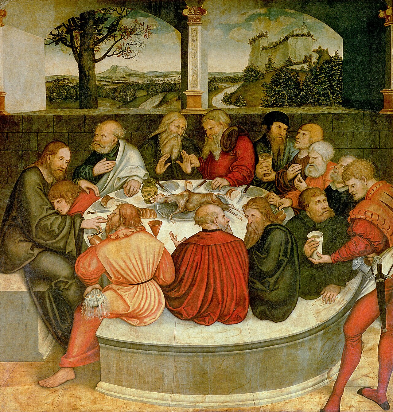 The Last Supper panel of the Wittenberg Altarpiece: Christ and the apostles gathered around a great round table, a servant pouring wine, a Saxon landscape behind.