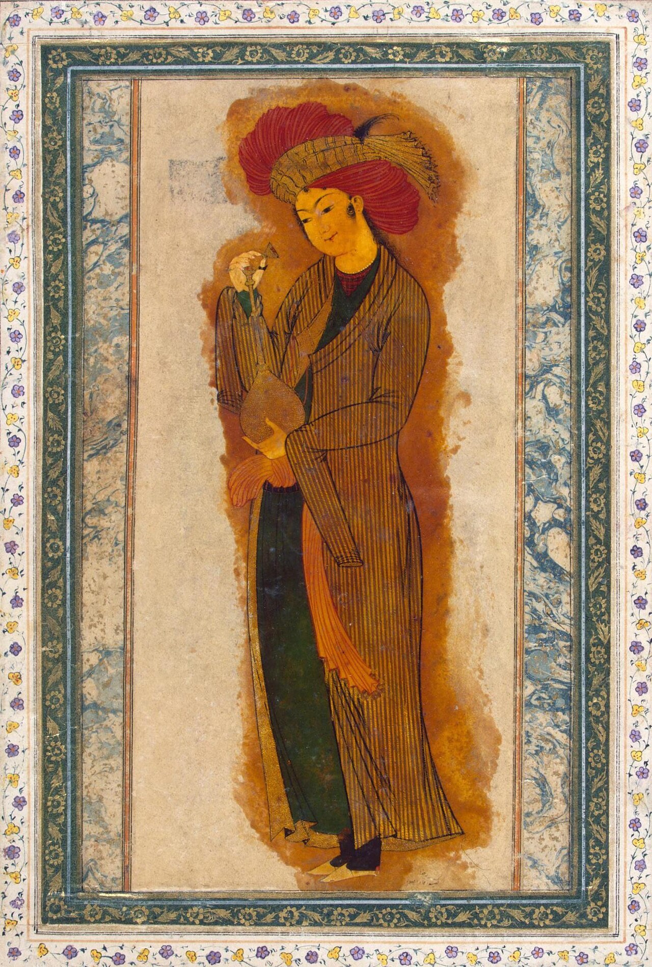 Reza Abbasi's single-figure painting of a standing youth in a striped robe and red turban, holding a wine bottle and cup within a marbled album border.