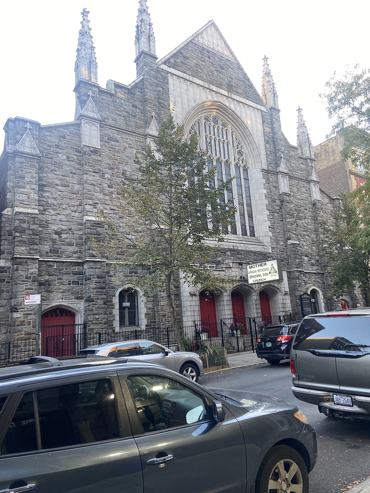 The stone Gothic facade of Mother A.M.E. Zion Church on a Harlem street.