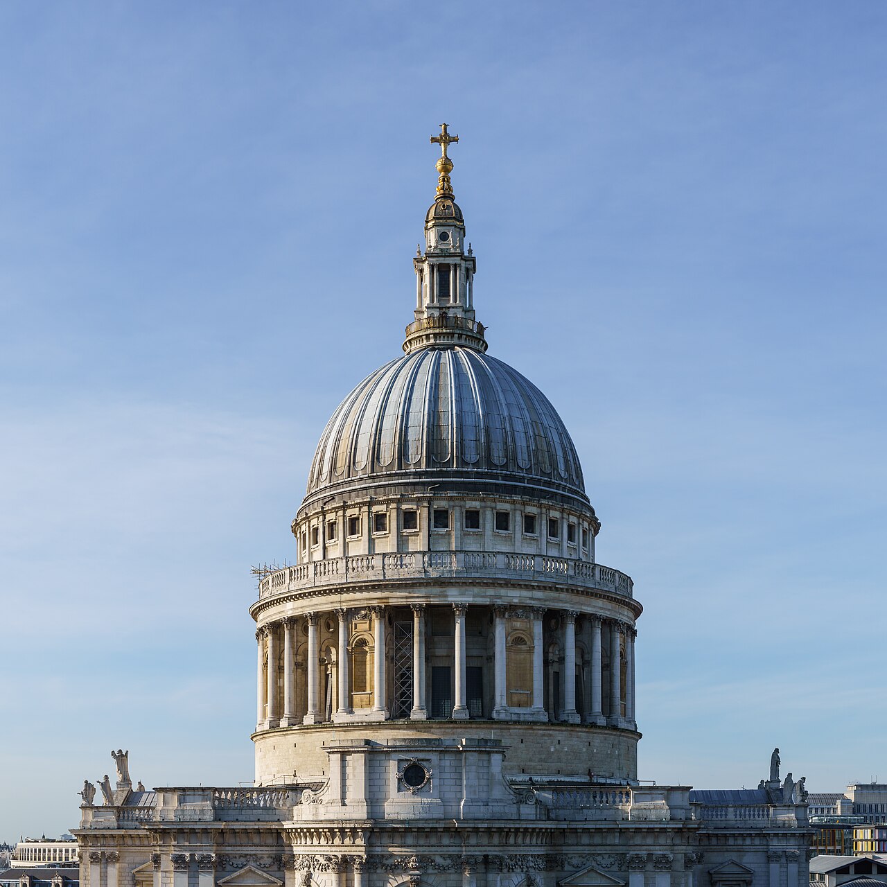 The dome of St Paul's Cathedral in London against a blue sky.