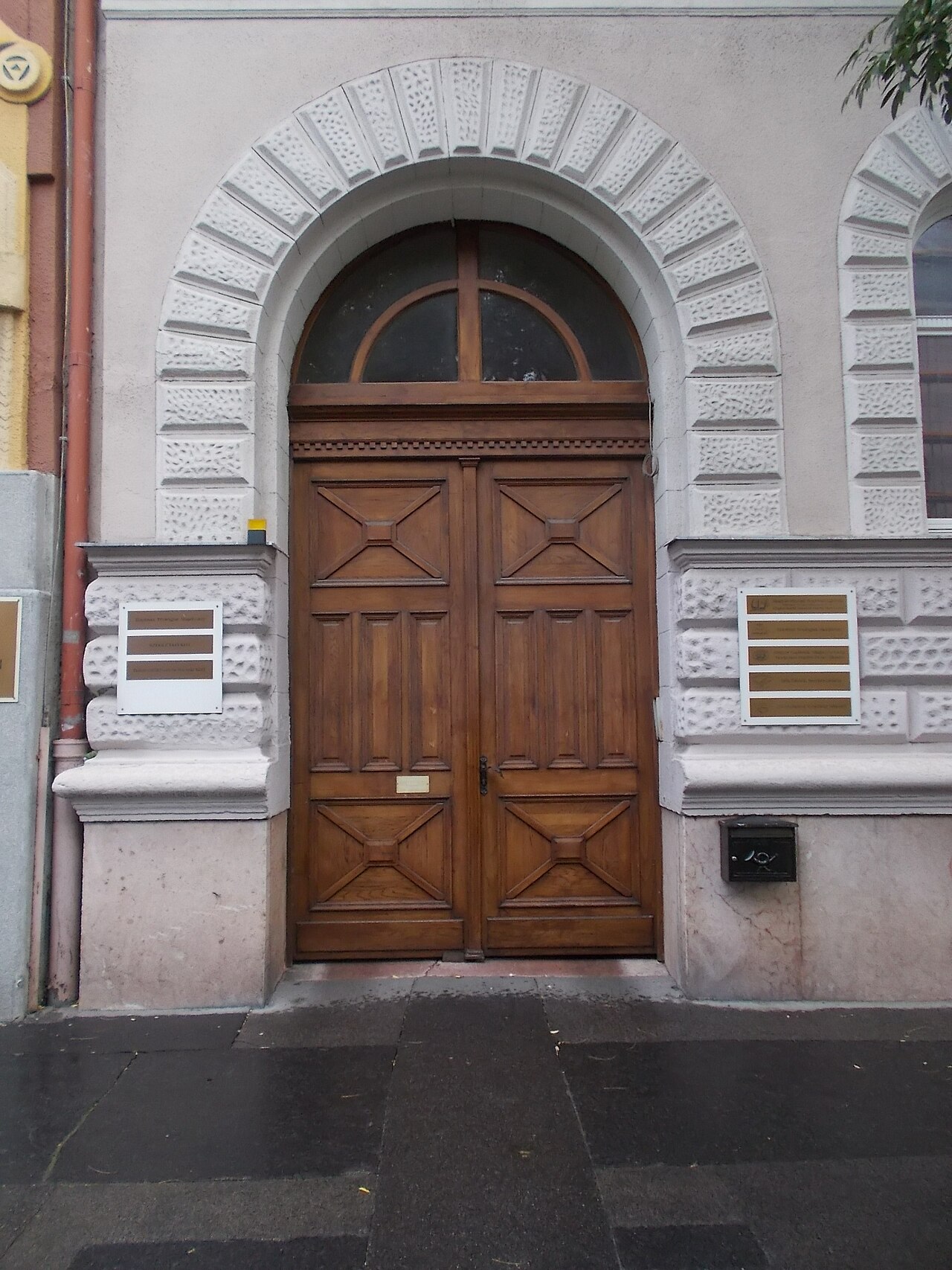 The arched wooden entrance of the Hungarian Baptist headquarters in Budapest.