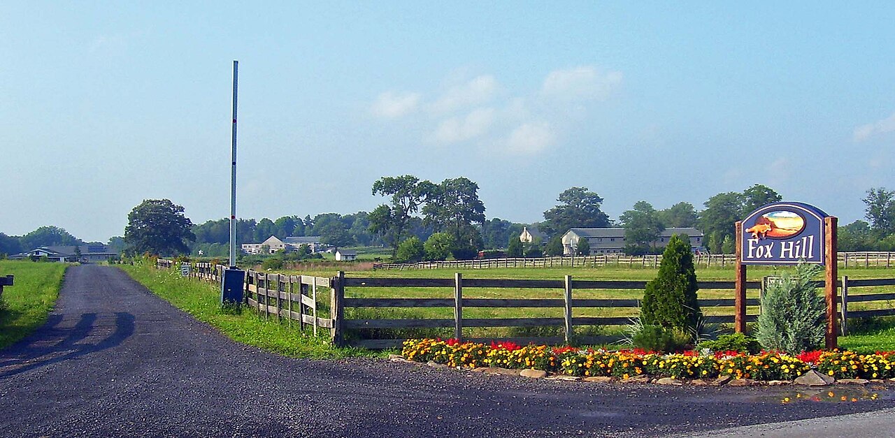 The entrance drive and sign of the Fox Hill Bruderhof community.