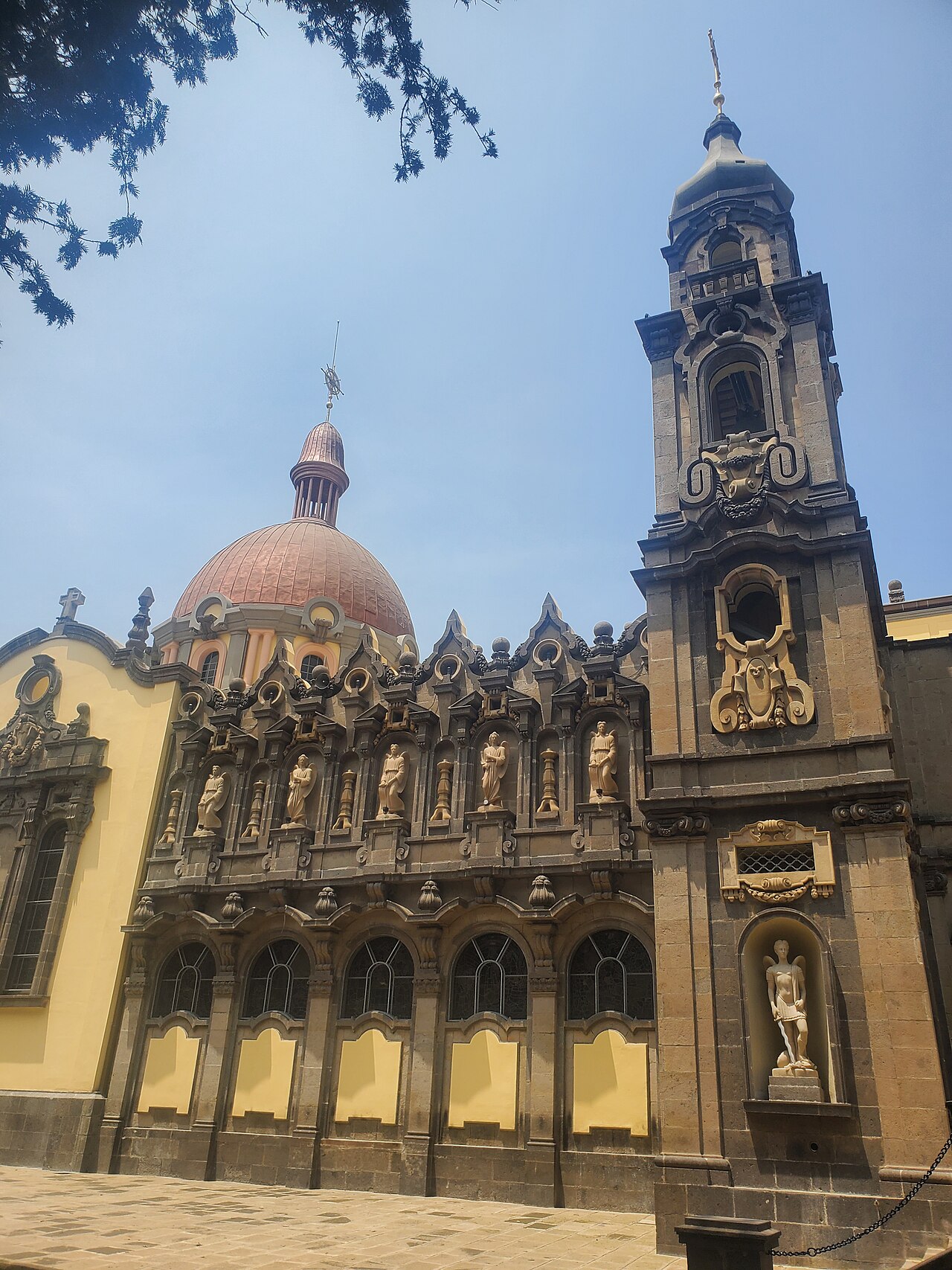 The ornate carved facade and bell tower of Holy Trinity Cathedral in Addis Ababa.