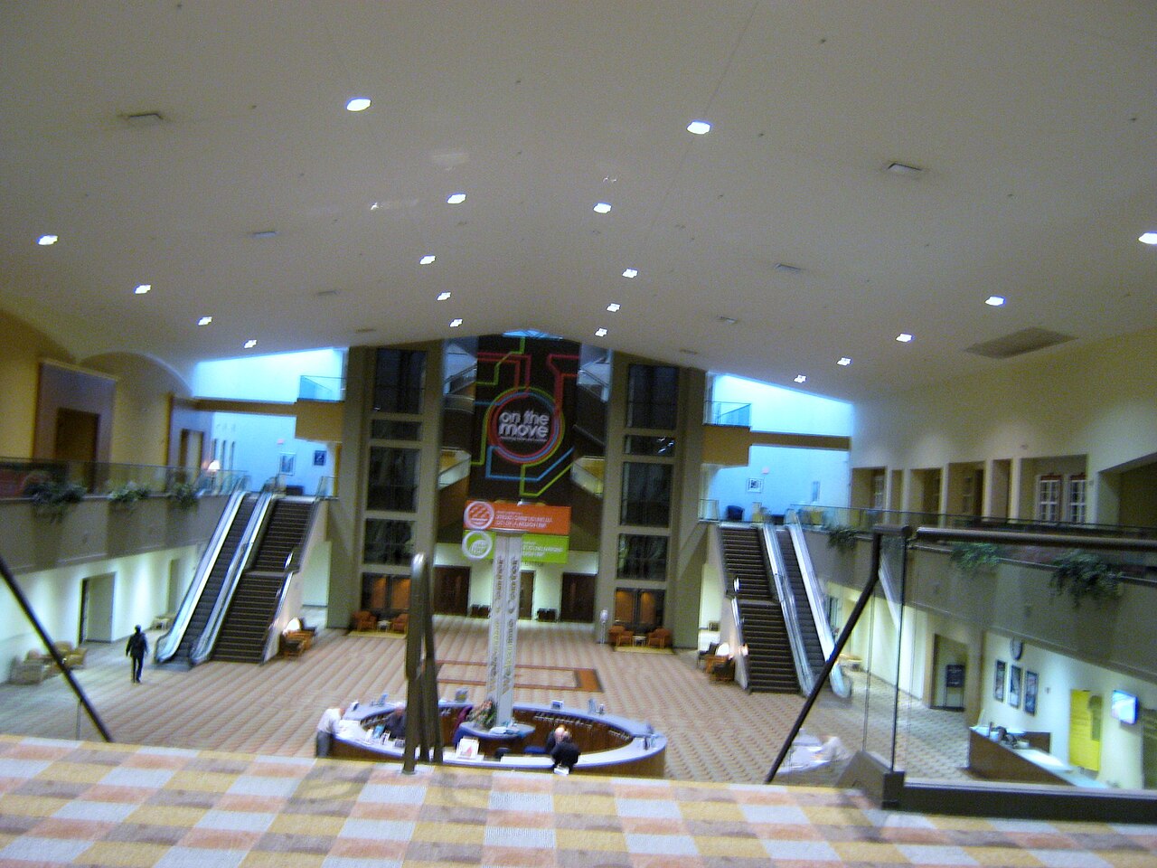 The bright multi-level atrium inside Southeast Christian Church in Louisville, escalators around a central fountain.
