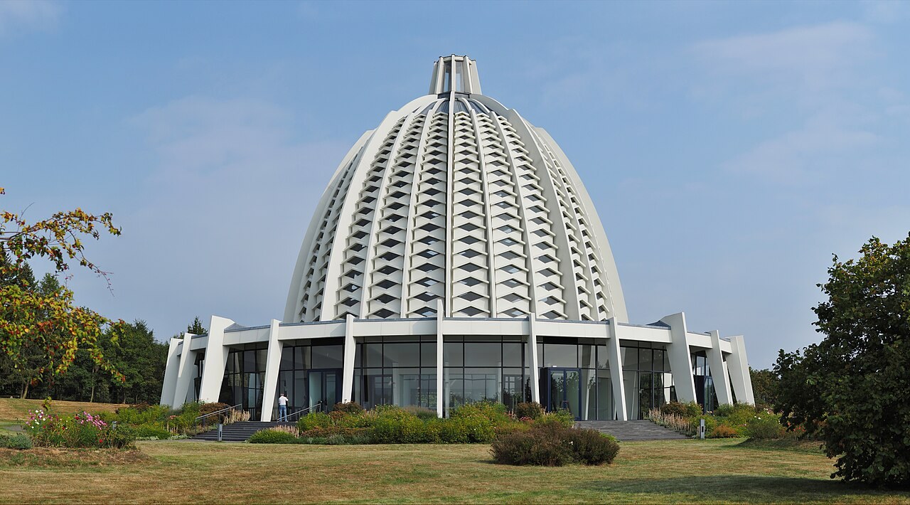 The domed Bahá'í House of Worship at Langenhain, Germany, the European Mother Temple, stands in green grounds.