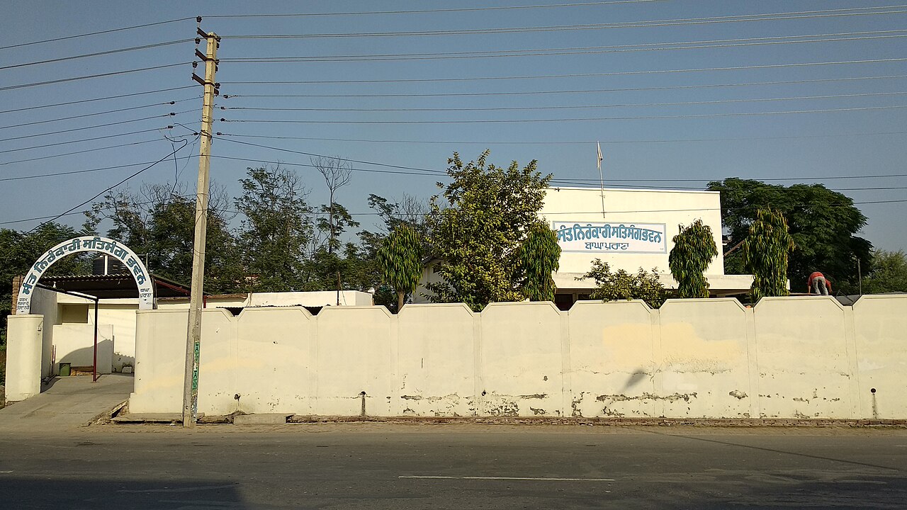 The Sant Nirankari Mission's bhawan at Bagha Purana in Punjab, its satsang hall behind the boundary wall.