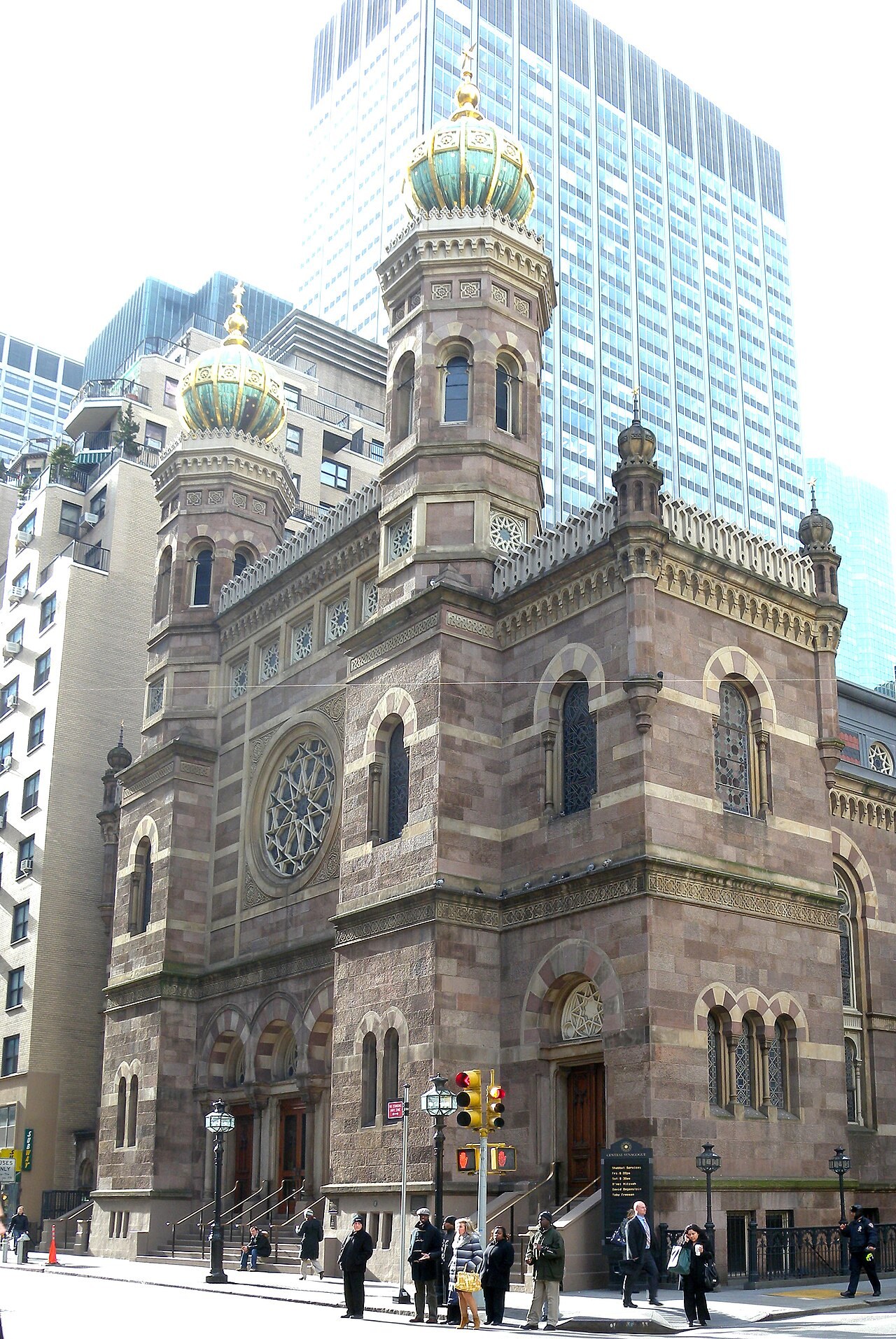 Central Synagogue's Moorish Revival towers and green domes rise over Lexington Avenue in New York.