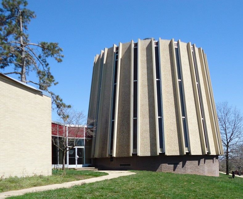 The round modern chapel of New Brunswick Theological Seminary, its ribbed walls rising from the lawn.