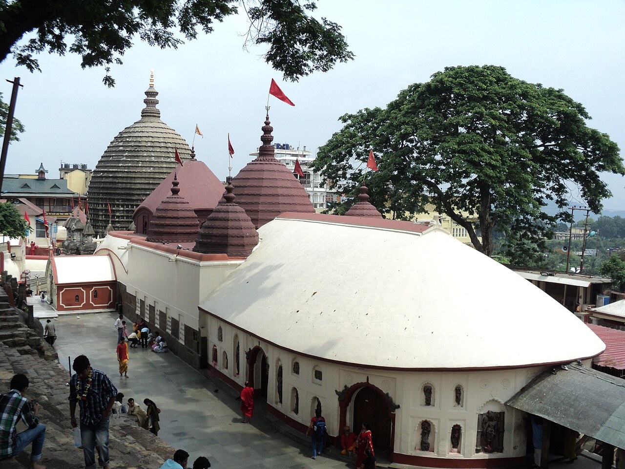 The red and white domed roofs of the Kamakhya Temple rise above its hillside complex at Guwahati.