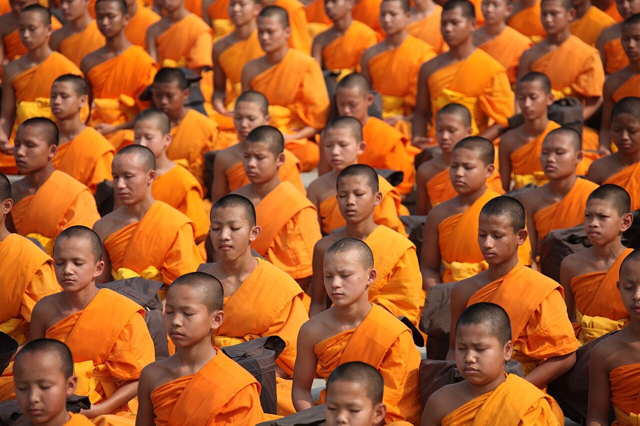 Buddhist novices seated in meditation.
