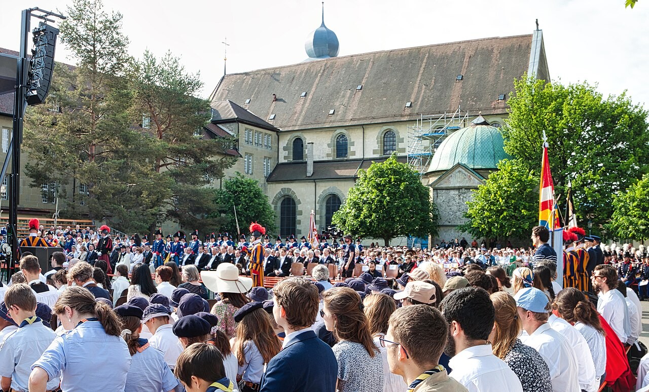 A Corpus Christi procession carrying the monstrance through the streets of Fribourg, Switzerland.
