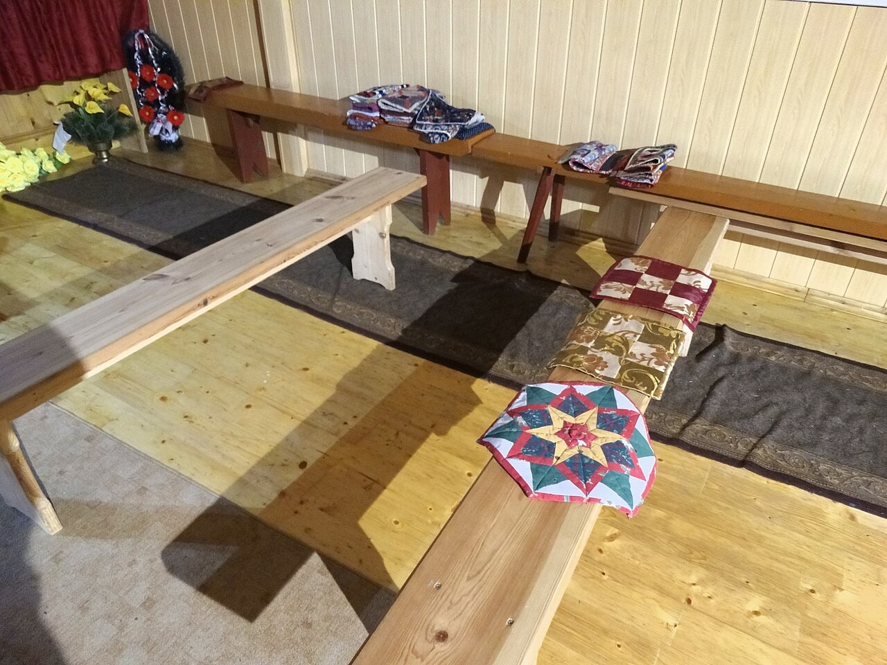 Rows of podruchniki, the small prayer mats used for full prostrations, laid out in an Old Believer church in Švenčionys, Lithuania.