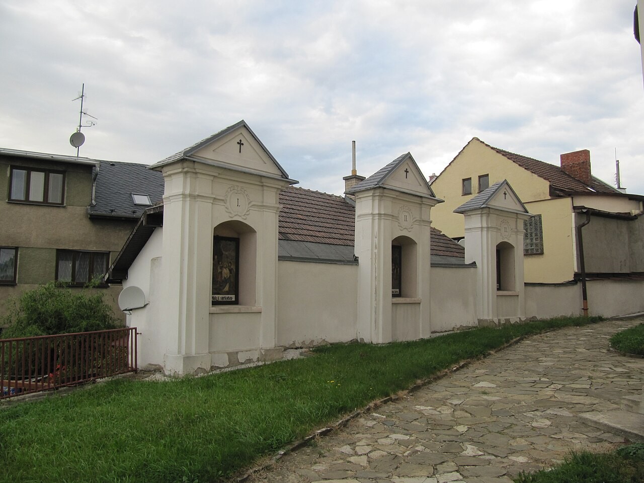 An outdoor Way of the Cross with a carved station relief in Brušperk, Czechia.