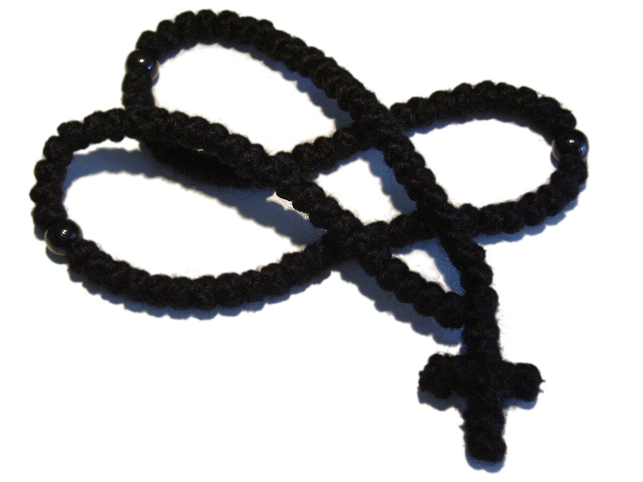 An Eastern Orthodox wool prayer rope with its knotted crosses and tassel.