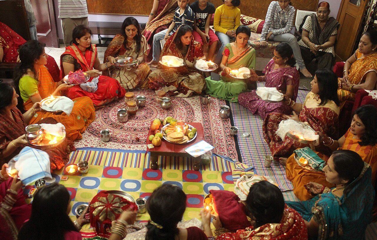Women performing the pūjā of Karva Chauth, the fast kept for their husbands' wellbeing.