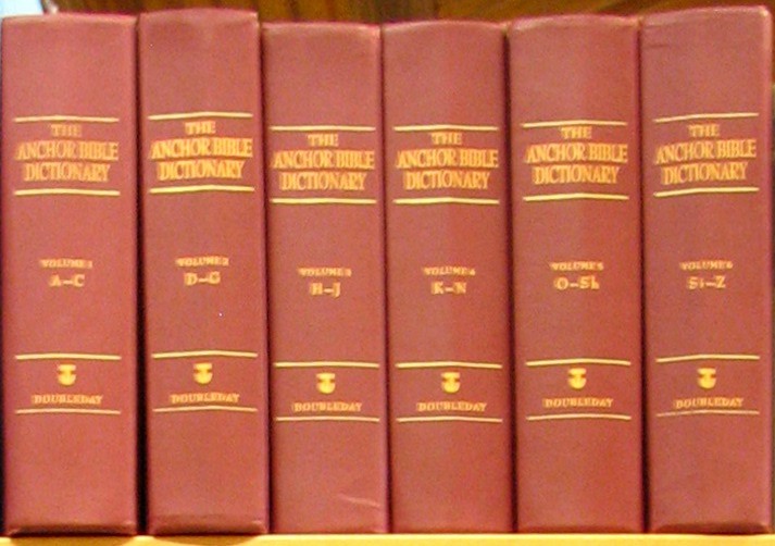 The six red hardcover volumes of The Anchor Bible Dictionary standing in a row, their spines lettered A-C through Si-Z with the Doubleday anchor emblem.