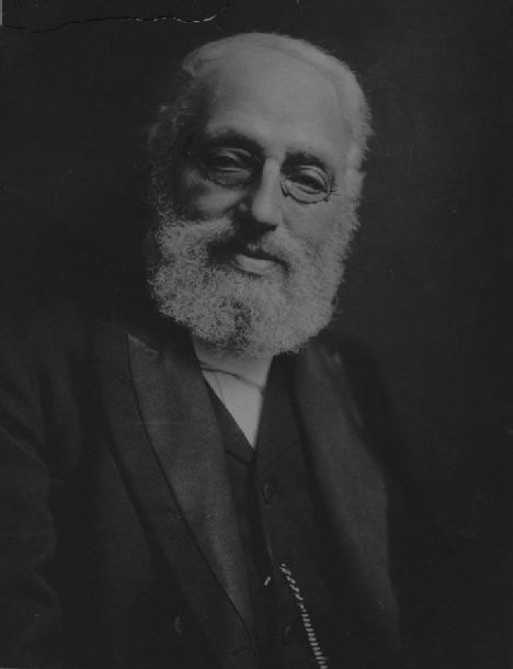 A photographic portrait of Marcus Jastrow, an elderly rabbi with a white beard and glasses, compiler of the rabbinic dictionary.