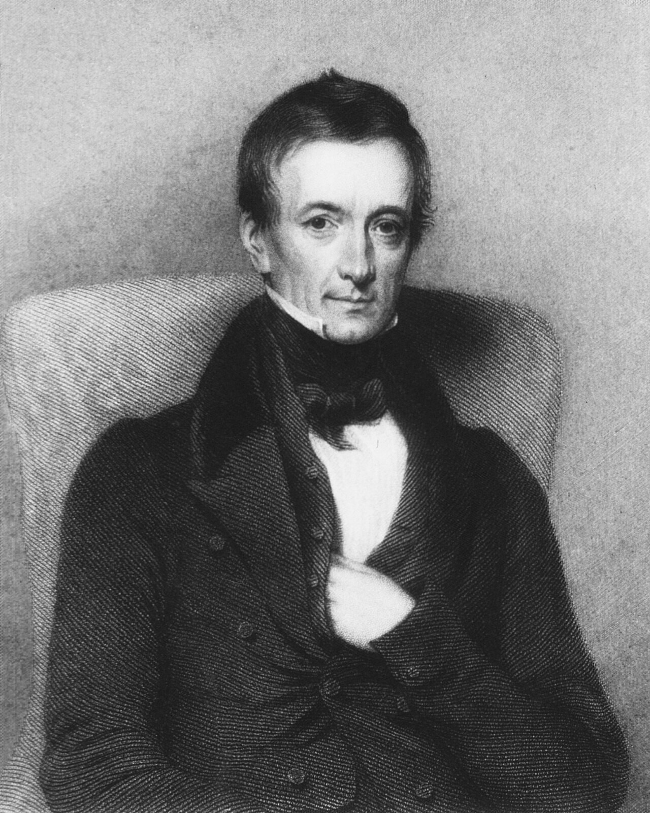 An engraved portrait of Peter Mark Roget seated in an armchair, a middle-aged man in a dark 1830s coat with one hand at his chest.