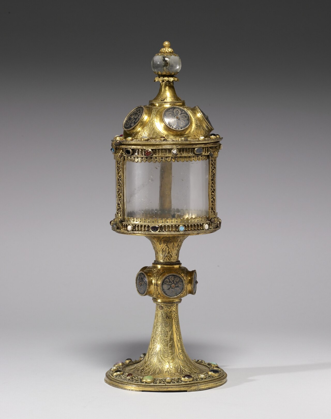 A medieval Mosan monstrance of gilt metal and rock crystal, made to display the consecrated host.