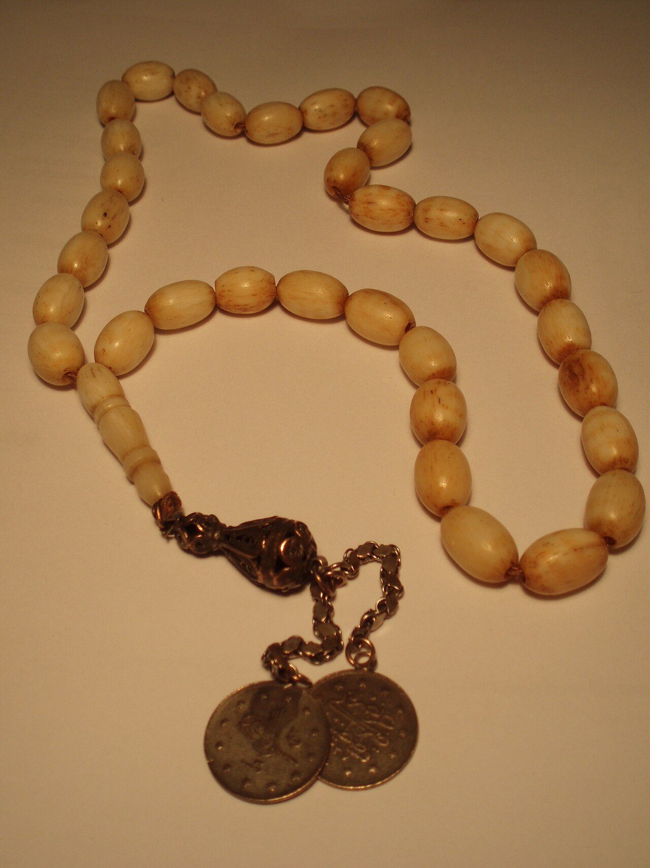 An ivory misbaha, the beads counted in dhikr