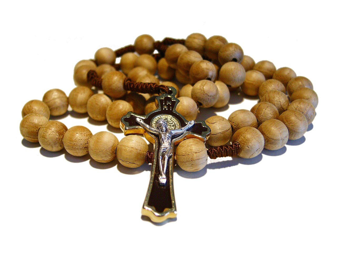 A wooden-bead rosary with its crucifix