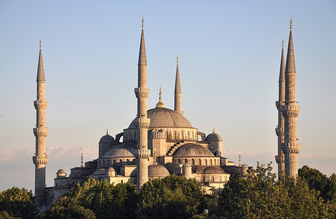 The Sultan Ahmed Mosque in Istanbul, its domes and six minarets above the trees.