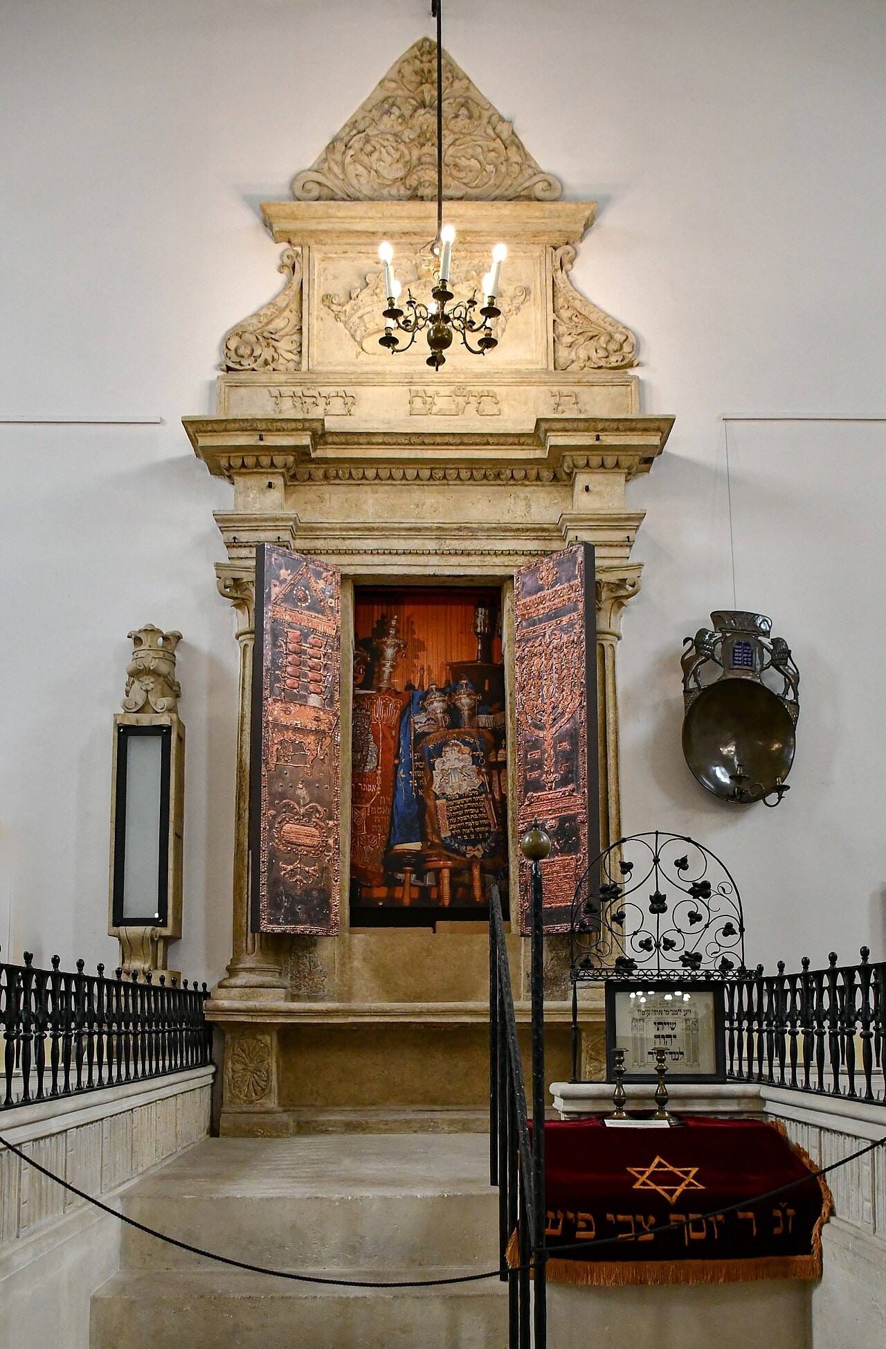 The ornate Torah ark of Kraków's Old Synagogue, its opening hung with embroidered curtains.