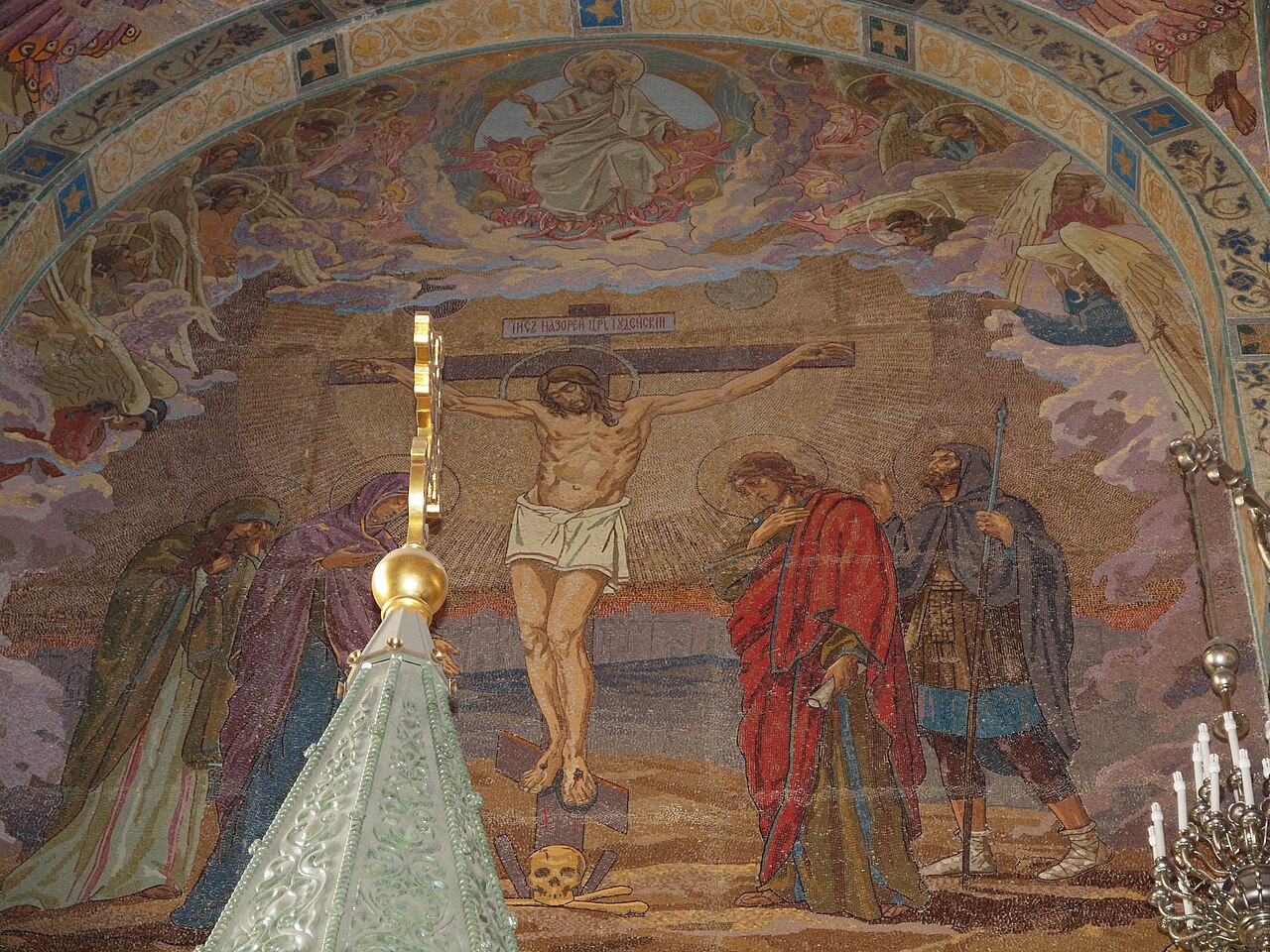 The mosaic-covered interior of the Church of the Saviour on Spilled Blood in St. Petersburg, its walls and vaults painted with icons.